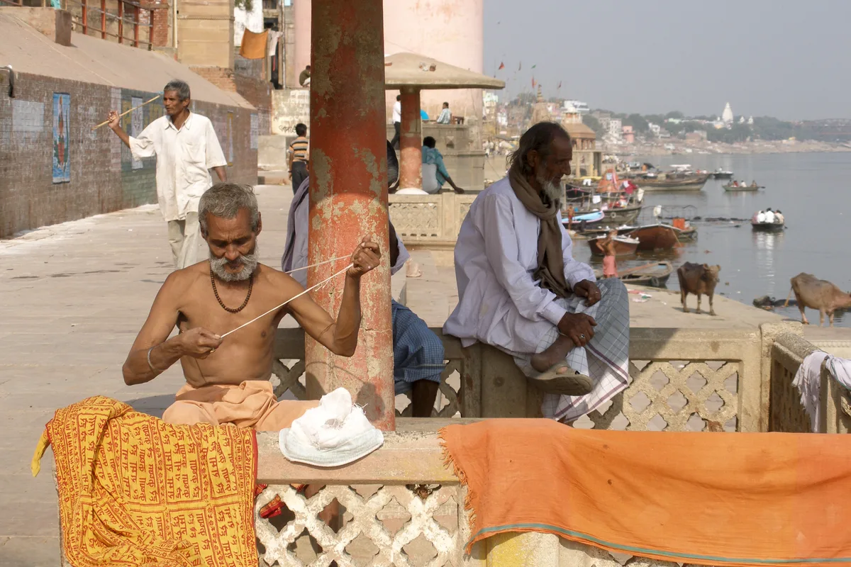 Pilgrims and visitors at the Varanasi ghats — ideal setting for a Kashi family tour
